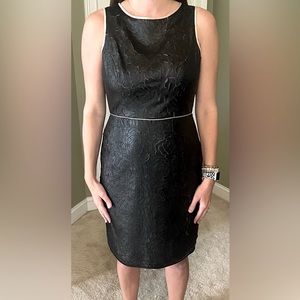 Laxer cut faux leather dress with floral pattern